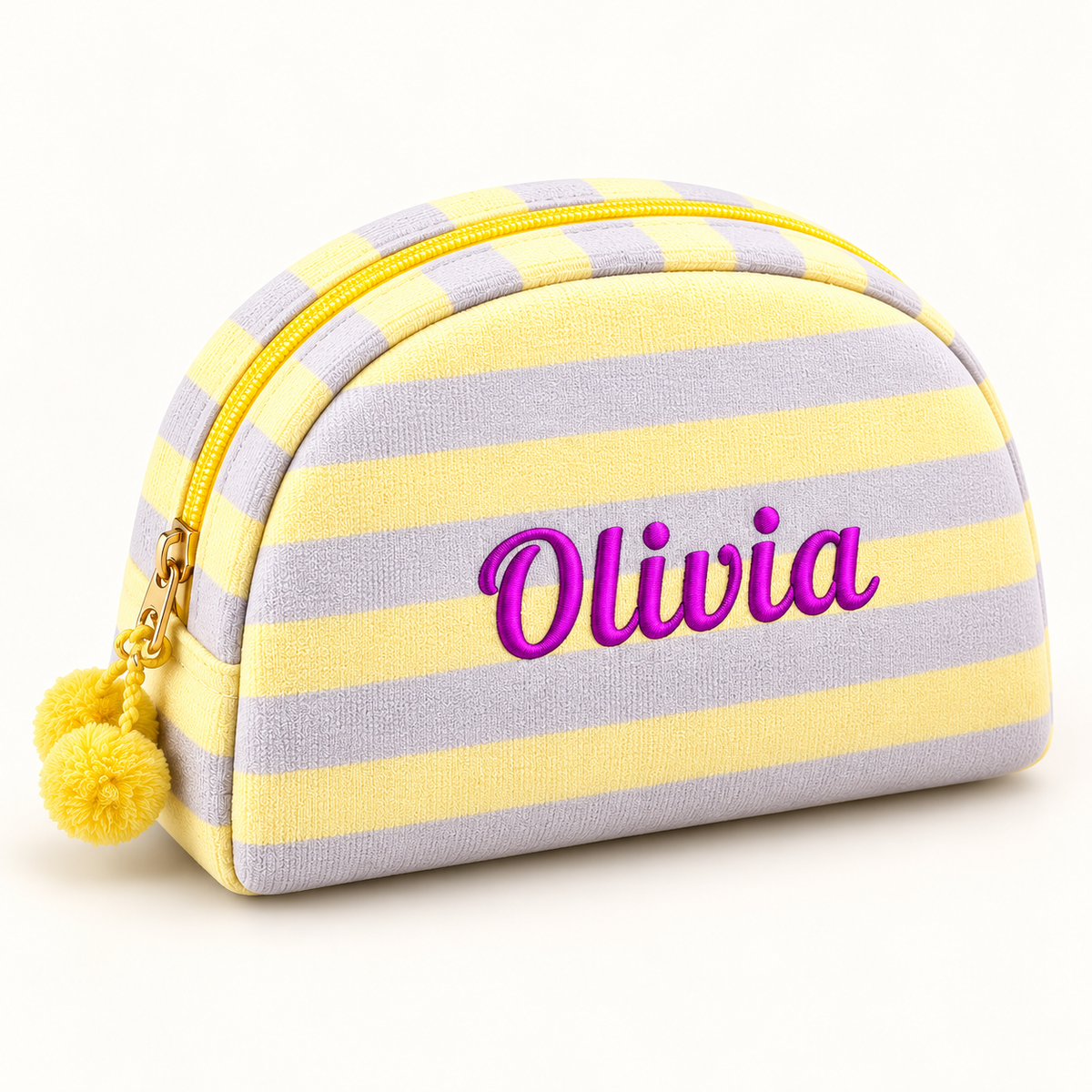 Lemon and lilac striped makeup pouch with purple Olivia embroidery and yellow pom-poms.