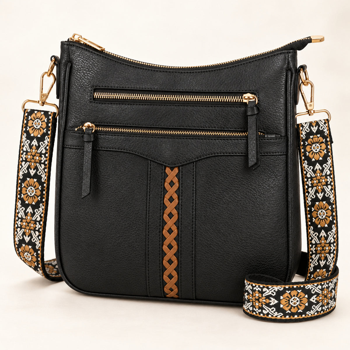 OVWQT Ramble Braided Crossbody Bag in Black with tan braided accent and dark floral strap.