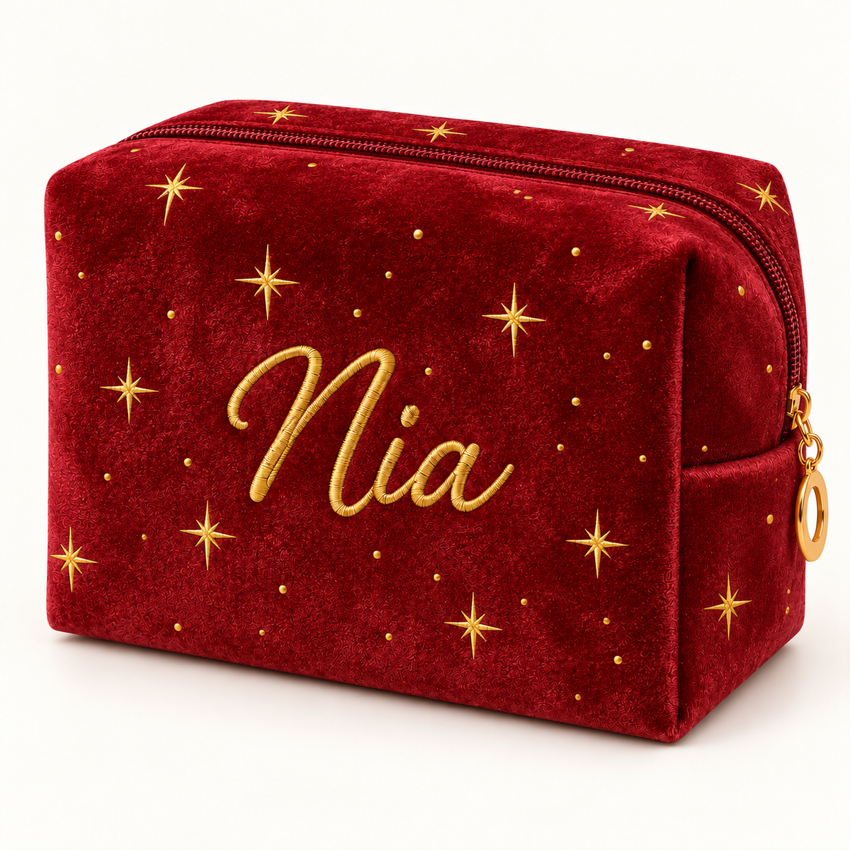 Burgundy personalized star velvet makeup bag with gold name embroidery.